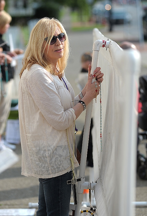 Respect Life sidewalk advocate Lisa Parker protests outside the Woman's Clinic on Main Street. (Dan Cappellazzo/Staff Photographer)